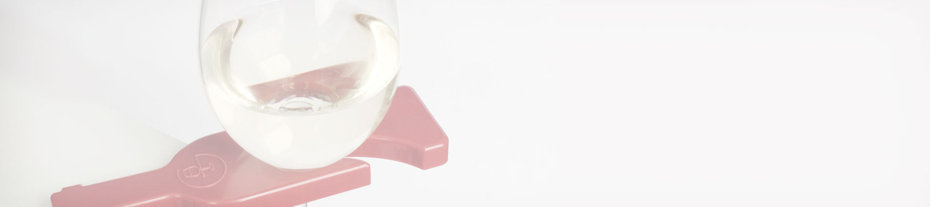 a close up of a red wineGrasp gadget holding a glass of white wine on a white background