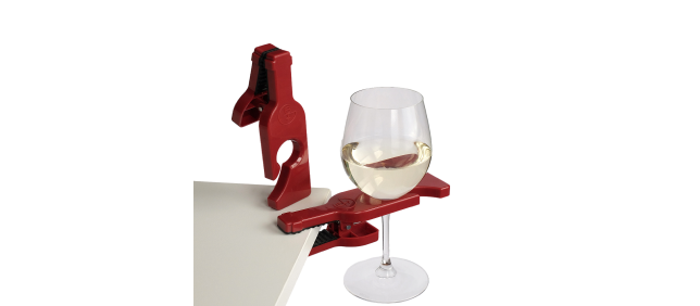 a glass of wine held on a table by a wineGrasp